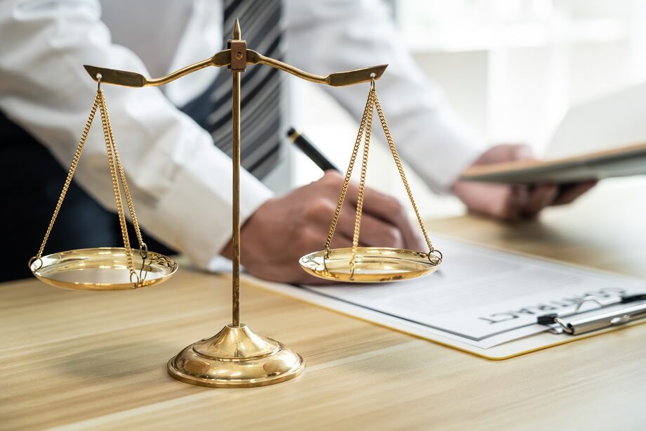Male lawyer working with litigation contract paper